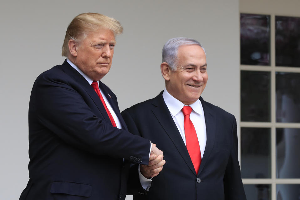 FILE - In this March 25, 2019 file photo, President Donald Trump welcomes visiting Israeli Prime Minister Benjamin Netanyahu to the White House in Washington. In the eyes of critics, Benjamin Netanyahu’s decision to bar two Democratic congresswomen at the request of President Donald Trump is the latest reckless gamble by a prime minister willing to sacrifice Israel’s national interests for short-term gain. And yet the pursuit of such allegedly short-term gains has kept Netanyahu in power for more than a decade. (AP Photo/Manuel Balce Ceneta, File)