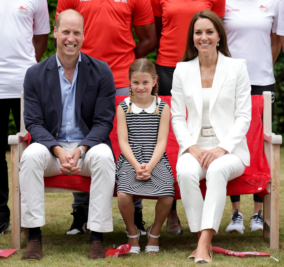 BIRMINGHAM, ENGLAND - AUGUST 02: Prince William, Duke of Cambridge, Catherine, Duchess of Cambridge and Princess Charlotte of Cambridge pose for a photograph as they visit Sportsid House at the 2022 Commonwealth Games on August 02, 2022 in Birmingham, England. The Duchess became the Patron of SportsAid in 2013, Team England Futures programme is a partnership between SportsAid, Sport England and Commonwealth Games England which will see around 1,000 talented young athletes and aspiring support staff given the opportunity to attend the Games and take a first-hand look behind-the-scenes. (Photo by Chris Jackson/Getty Images)