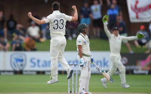 Mark Wood celebrates after dismissing Zubayr Hamza of South Africa during Day Four of the Third Test  - Credit: Stu Forster/Getty Images