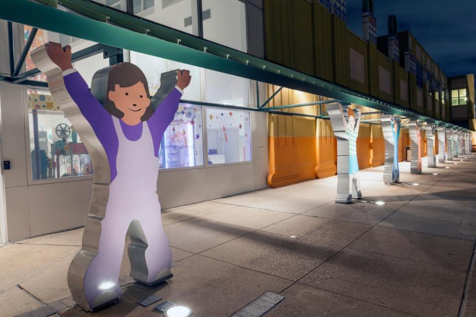 The Children’s Museum of Houston illuminated at night via Getty Images