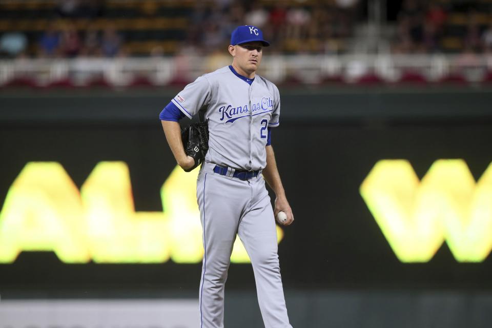 Kansas City Royals pitcher Mike Montgomery reacts after giving up a walk to Minnesota Twins' Luis Arraez duirng the second inning of a baseball game Thursday, Sept. 19, 2019, in Minneapolis. (AP Photo/Jim Mone)