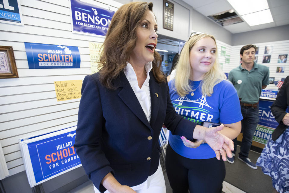 GRAND RAPIDS, MI - AUGUST 02: Michigan Governor Gretchen Whitmer (left) meets with volunteers at a canvass kickoff event on Michigan Primary Election Day on August 2, 2022 in Grand Rapids, Michigan.  / Credit: Bill Pugliano / Getty Images