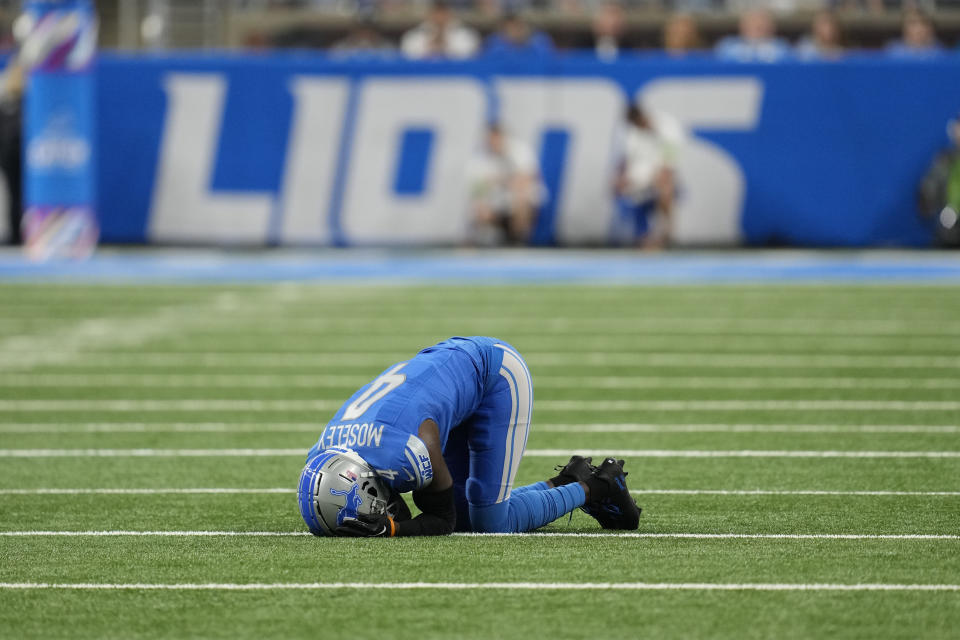 Detroit Lions cornerback Emmanuel Moseley (4) lies in the turf after being injured in the first half of an NFL football game against the Carolina Panthers in Detroit, Sunday, Oct. 8, 2023. (AP Photo/Paul Sancya)