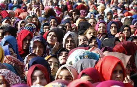 Students of Tevfik Ileri Imam Hatip School wait for the arrival of President Tayyip Erdogan for the opening ceremony in Ankara November 18, 2014. REUTERS/Umit Bektas