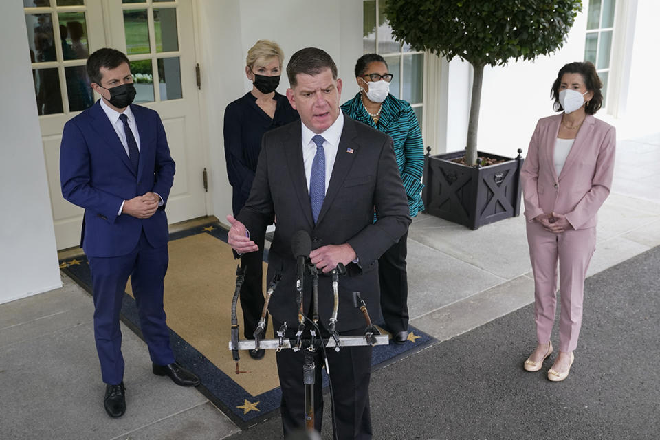 Labor Secretary Marty Walsh, center, speaks with reporters outside the West Wing of the White House after a meeting with President Joe Biden and Vice President Kamala Harris, Friday, May 7, 2021, in Washington. Standing behind Walsh are Transportation Secretary Pete Buttigieg, from left, Energy Secretary Jennifer Granholm, Secretary of Housing and Urban Development Marcia Fudge and Commerce Secretary Gina Raimondo. (AP Photo/Patrick Semansky)