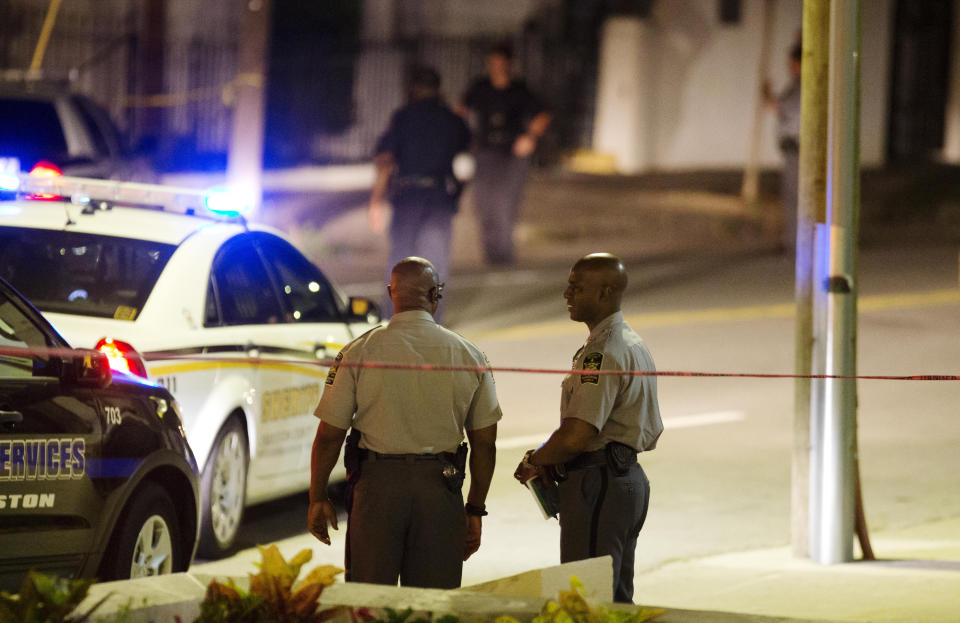 Police stand outside the Emanuel AME Church. (AP Photo/David Goldman)