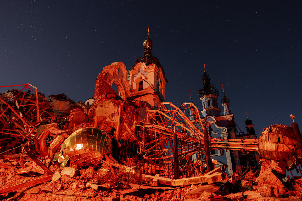 A cupola lies on the ground in front of the Orthodox Church which was destroyed by Russian forces in the recently retaken village of Bogorodychne, Ukraine, Saturday, Jan. 7, 2022. (AP Photo/Evgeniy Maloletka)