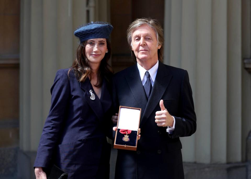 Sir Paul McCartney and his wife Nancy Shevell after he was made a Companion of Honour (Steve Parsons/PA) (PA Archive)
