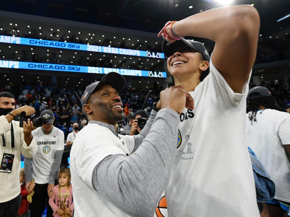 James Wade and Candace Parker celebrate winning the 2021 WNBA championship.