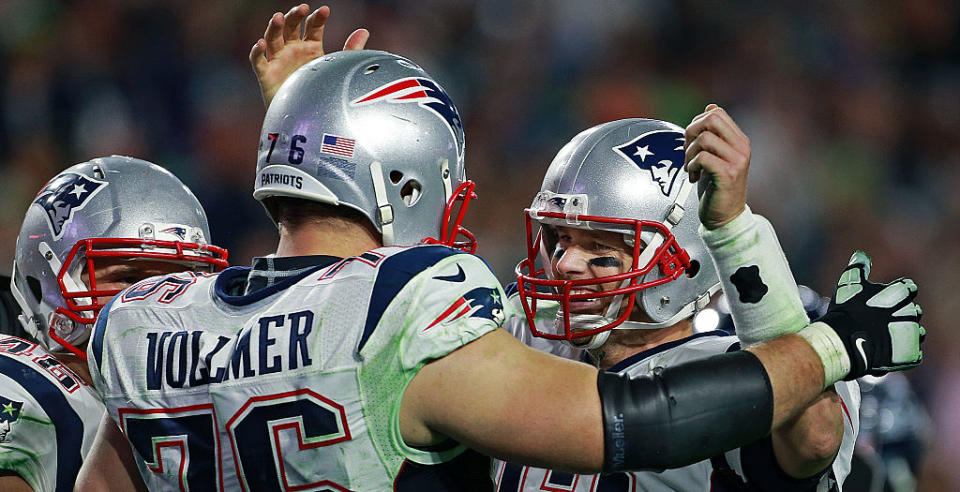 Tom Brady and Sebastian Vollmer. (Getty Images)