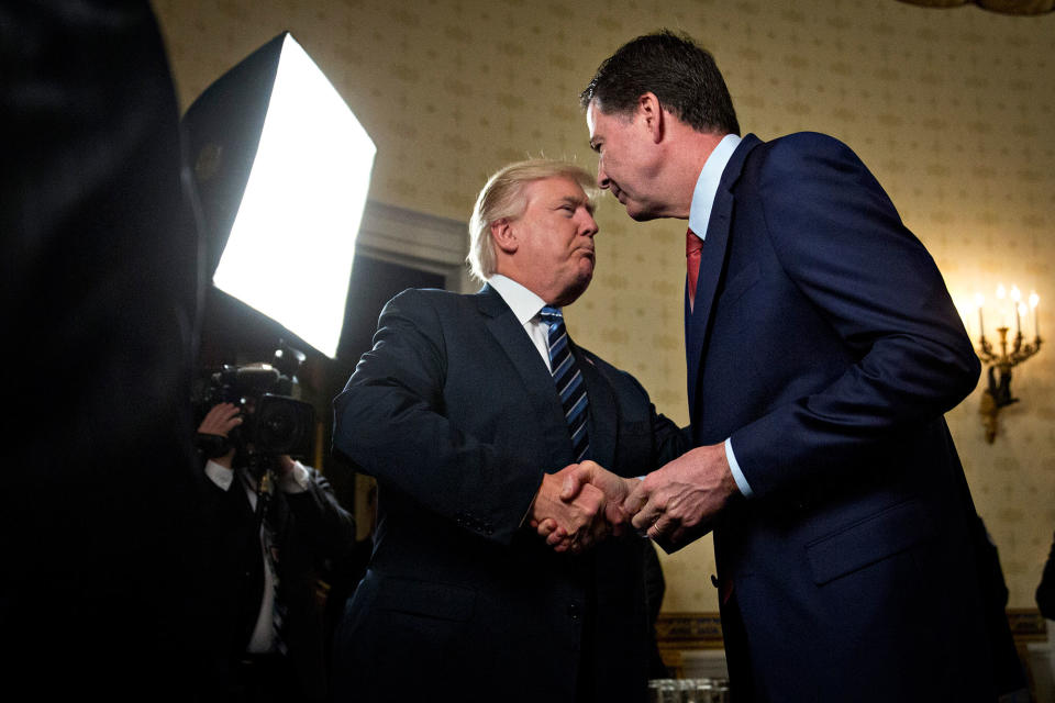 <p>JAN. 22, 2017 – President Donald Trump, left, shakes hands with James Comey, director of the Federal Bureau of Investigation (FBI), during an Inaugural Law Enforcement Officers and First Responders Reception in the Blue Room of the White House in Washington, D.C. Trump, on June 16, lashed out at the Justice Department official with authority over the special counsel probe of Russian election-meddling, and acknowledged that his firing of Comey as FBI director is a focus of the investigation. (Photo: Andrew Harrer-Pool/Getty Images) </p>