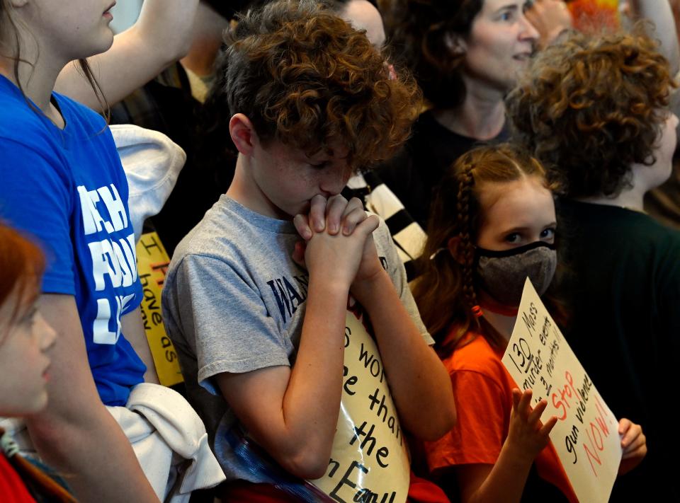 A student prays inside the Tennessee State Capitol as he demonstrates with other students and parents against gun violence and calling for gun law reform during the March For Our Lives walkout April 3 in Nashville. The group is demanding tougher gun control laws after the mass shooting at Covenant School during which three students and three adults were killed.