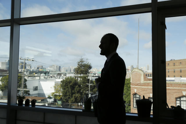 FILE - San Francisco District Attorney Chesa Boudin is silhouetted looking out at the skyline from his office in San Francisco on Jan. 30, 2020. In San Francisco, homeless tents, open drug use, home break-ins and dirty streets have proliferated during the pandemic. The quality of life crimes and a laissez-faire approach by officials to brazen drug dealing have given residents a sense the city is in decline. In a sign of civic frustration, San Franciscans will vote in June on whether to recall Boudin, a former public defender and politically progressive politician elected in 2019 whose critics say he's too lenient on crime. (AP Photo/Eric Risberg, File)