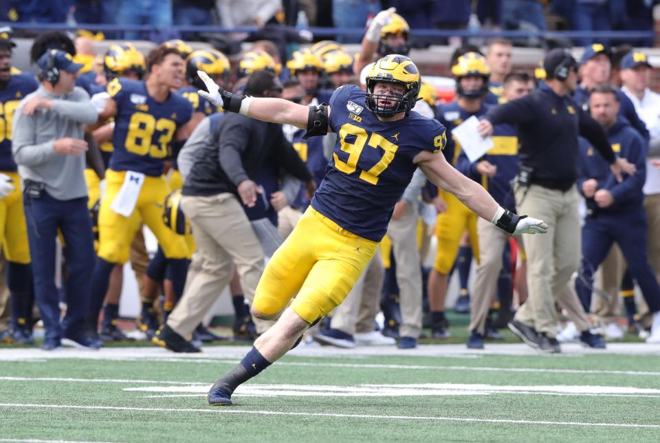 Michigan defensive lineman Aidan Hutchinson celebrates after sacking Iowa quarterback Nate Stanley during the second half of U-M's 10-3 win on Saturday, Oct. 5, 2019, at Michigan Stadium.