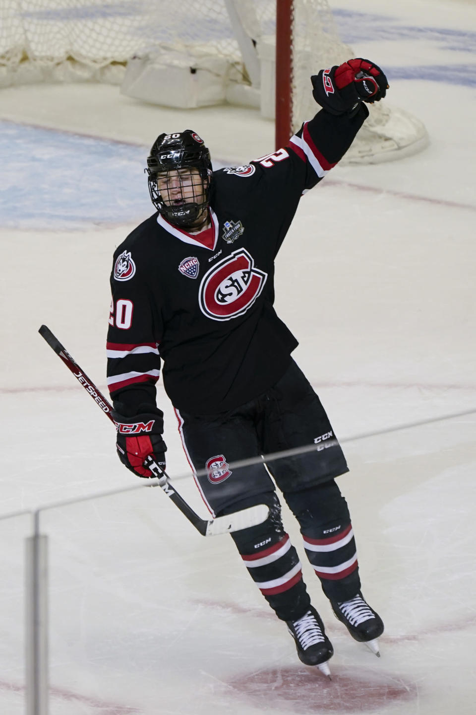 St. Cloud State's Nolan Walker celebrates after scoring a goal with less than a minute left to break a tie against Minnesota State during the third period of an NCAA men's Frozen Four hockey semifinal in Pittsburgh, Thursday, April 8, 2021. St. Cloud State won 5-4 to advance to the championship game Saturday. (AP Photo/Keith Srakocic)