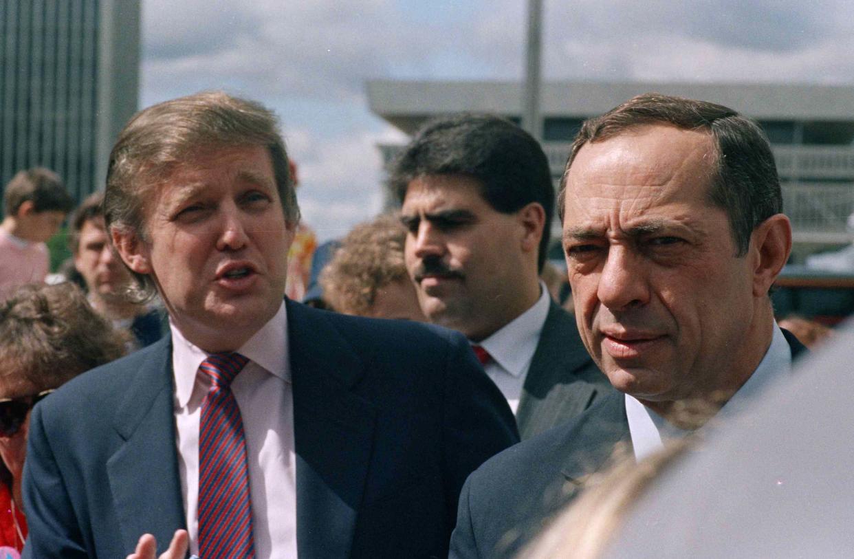 Developer Donald Trump and New York State Gov. Mario Cuomo get together before the start of the Tour De Trump bicycle race in Albany, New York on May 6, 1989.