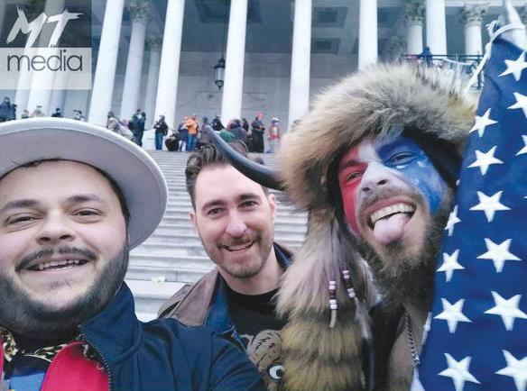 Nicholas DeCarlo, 32, of Fort Worth, Texas, left, and Nicholas Ochs, 36, center, of Honolulu at the Capitol on Jan. 6, 2021. (DOJ)