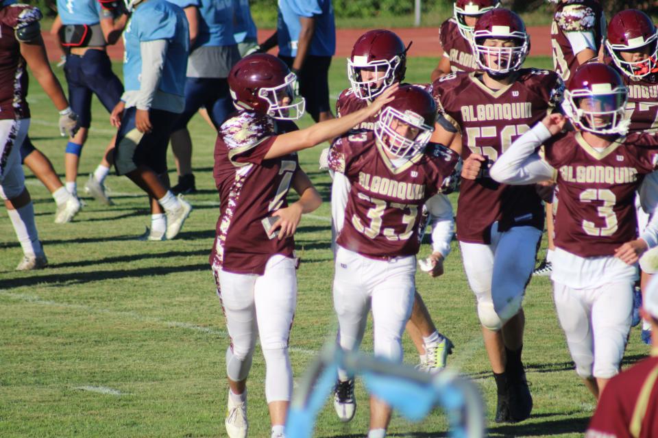 Algonquin's Nick Klein, left, celebrates a good conversion kick with his brother, Alex.