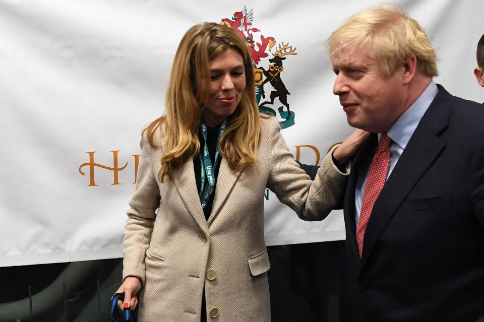 Prime Minister Boris Johnson with partner Carrie Symonds and dog Dilyn at the count for the Uxbridge & Ruislip South constituency in the 2019 General Election.