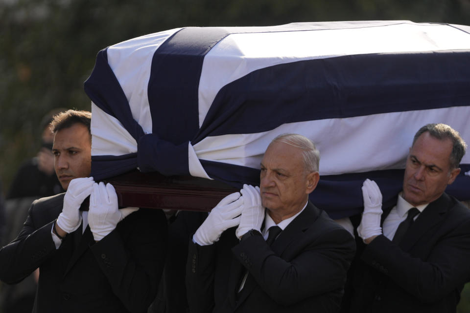 The coffin of former king of Greece Constantine II arrives at the Metropolitan cathedral for his funeral in Athens, Monday, Jan. 16, 2023. Constantine died in a hospital late Tuesday at the age of 82 as Greece's monarchy was definitively abolished in a referendum in December 1974. (AP Photo/Petros Giannakouris)