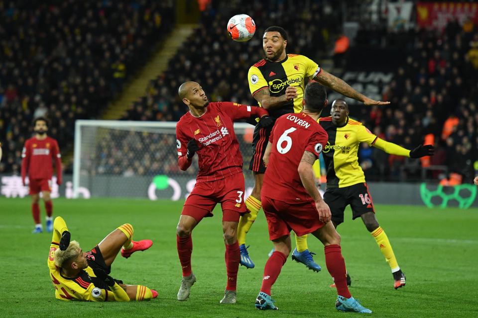 Watford's English striker Troy Deeney (C) heads the ball during the English Premier League football match between Watford and Liverpool at Vicarage Road Stadium in Watford, north of London on February 29, 2020. (Photo by JUSTIN TALLIS / AFP) / RESTRICTED TO EDITORIAL USE. No use with unauthorized audio, video, data, fixture lists, club/league logos or 'live' services. Online in-match use limited to 120 images. An additional 40 images may be used in extra time. No video emulation. Social media in-match use limited to 120 images. An additional 40 images may be used in extra time. No use in betting publications, games or single club/league/player publications. /  (Photo by JUSTIN TALLIS/AFP via Getty Images)