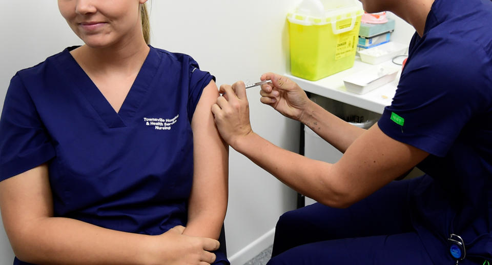 A health worker getting the Covid vaccine.