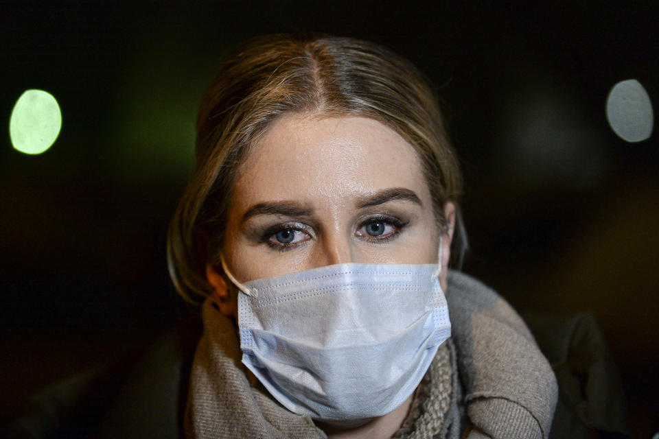 Lyubov Sobol, a lawyer for Navalny's Fund for Fighting Corruption speaks to the media at a police station in Moscow, Russia, Thursday, Jan. 21, 2021. Police on Thursday took into custody two top associates of jailed Russian opposition leader Alexei Navalny ahead of planned protests against his detention. His spokeswoman Kira Yarmysh was detained by police at her residence several hours after Lyubov Sobol, a lawyer for Navalny's Fund for Fighting Corruption, was detained. (AP Photo/Denis Kaminev)