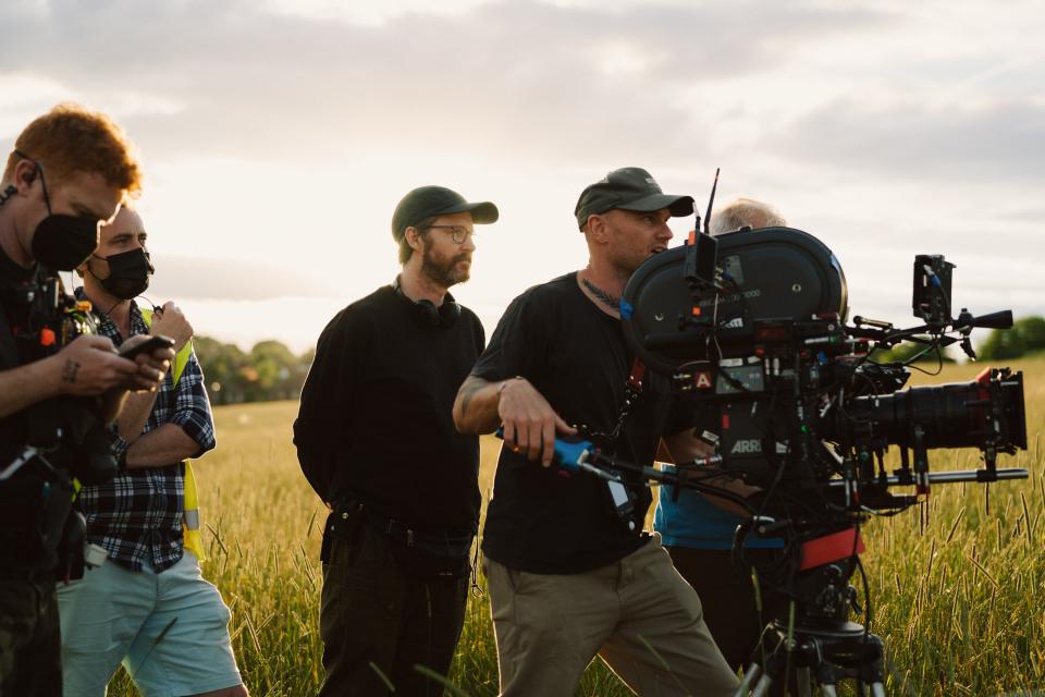 Andrew Haigh (center) on the set of All of Us Strangers.