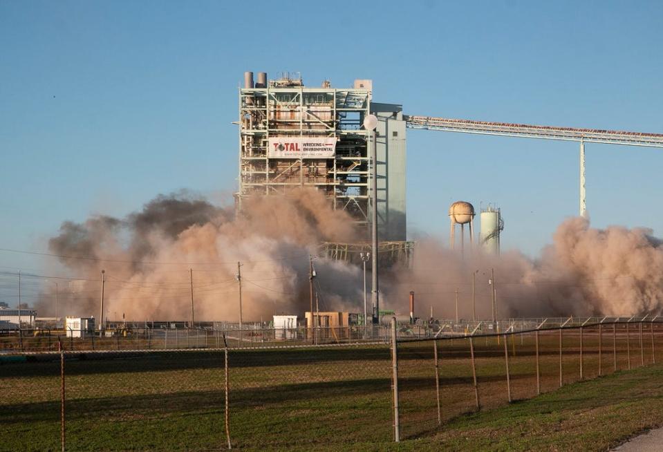 Lakeland Electric's Unit 3 at the McIntosh Power Plant is seen in a time lapse during the demolition and implosion of the structure Saturday morning.