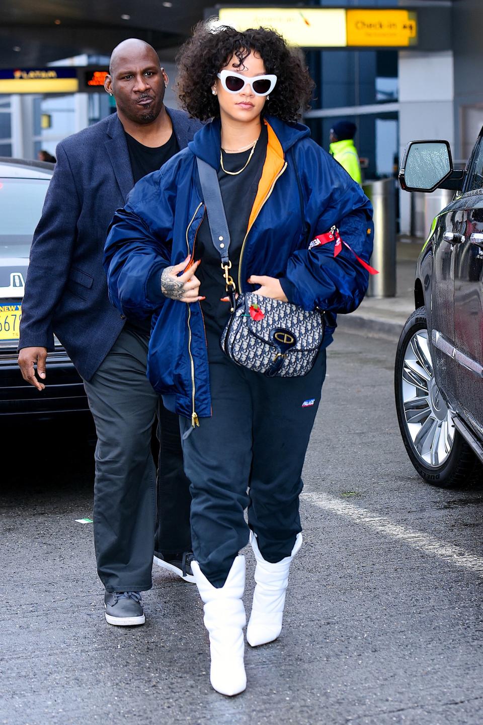 Is there any situation that Rihanna isn't best-dressed for? Copy her streetwear-style puffer and boots for a balance between comfy and cool.