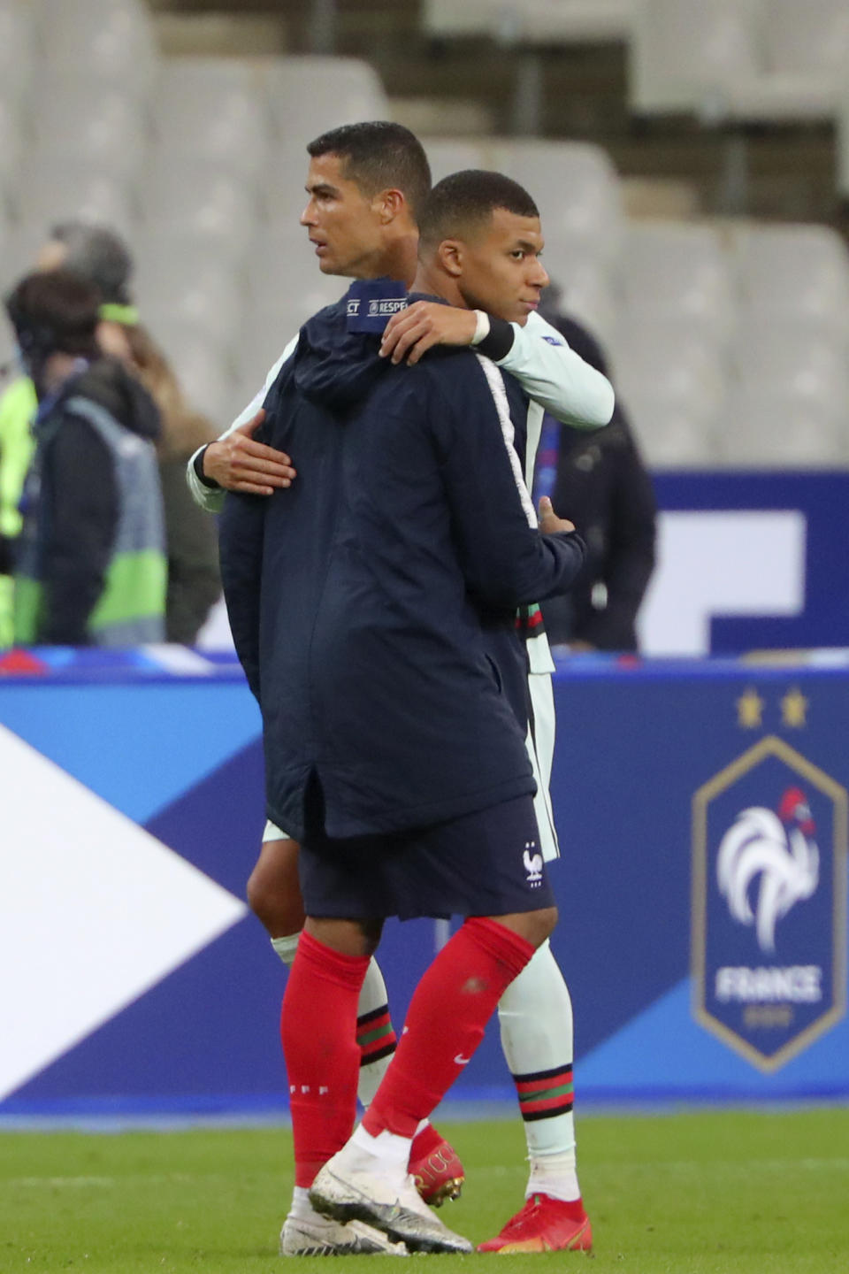 France's Kylian Mbappe and Portugal's Cristiano Ronaldo, left, greet each other at the end of the UEFA Nations League soccer match between France and Portugal at the Stade de France in Saint-Denis, north of Paris, France, Sunday, Oct. 11, 2020. (AP Photo/Thibault Camus)