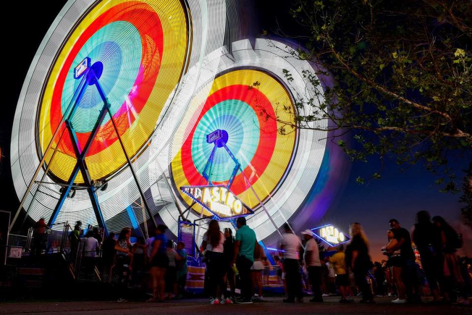 Fairgoers line up for the Astro Wheel at the Lexington Lions Club Bluegrass Fair at Masterson Station Park in Lexington, Ky., Tuesday, June 15, 2021.