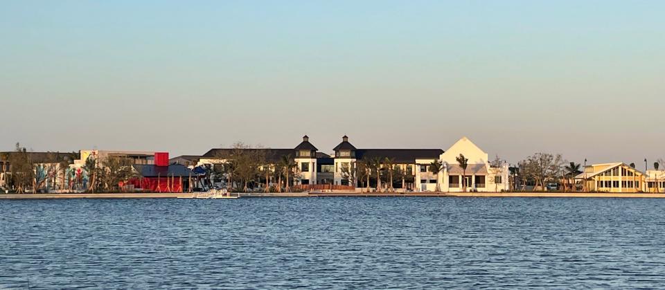 Downtown Wellen as seen from Preto Boulevard, opposite the 80-acre man-made lake. About 55,000 square feet of commercial, retail and restaurant space is nearly built out in the fully leased Phase One, which will begin opening in early 2023.