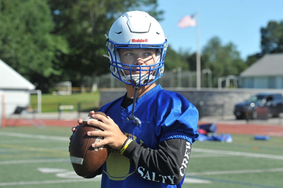 Norwell High School quarterback Colin McCarthy sets to pass during football practice, Friday, Sept. 1, 2023.