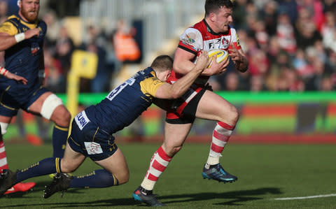 Matt Scott tries to evade a challenge for Gloucester - Credit: Getty Images