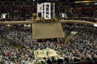 FILE - In this May 12, 2019, file photo, banners thanking for a sellout crowd are displayed on the first day of Summer Grand Sumo Tournament in Tokyo. U.S. President Donald Trump’s Japan visit starting on Saturday, May 25, 2019, is to focus on personal ties with Japanese Prime Minister Shinzo Abe rather than substantive results on trade, security or North Korea. Then the two leaders and their wives will watch sumo together in the evening before a restaurant dinner. (Yoshitaka Sugawara/Kyodo News via AP, File)