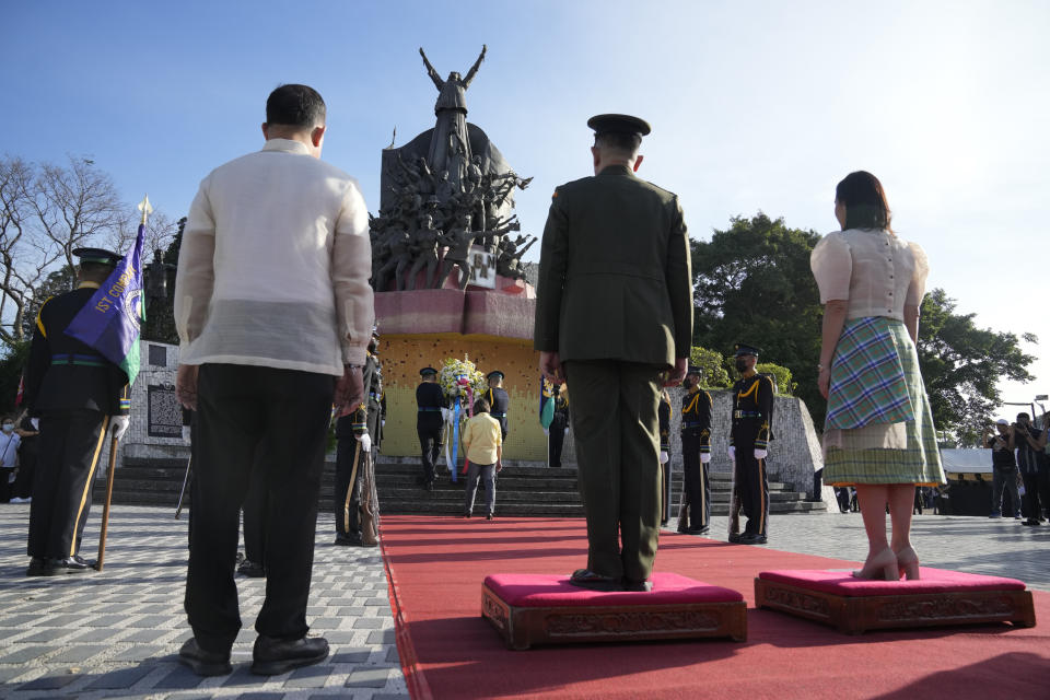 Wreaths are laid during ceremonies marking the 37th anniversary of the near-bloodless coup popularly known as "People Power" revolution that ousted the late Philippine dictator Ferdinand Marcos from 20-year-rule at the People's Power Monument in Quezon city, Philippines on Saturday Feb. 25, 2023. It is the first year marking the event under the rule of Marcos Jr. (AP Photo/Aaron Favila)