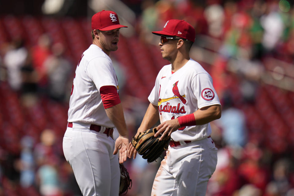 St. Louis Cardinals' Nolan Gorman, left, and Tommy Edman celebrate a 14-5 victory over the Arizona Diamondbacks in a baseball game Wednesday, April 19, 2023, in St. Louis. (AP Photo/Jeff Roberson)