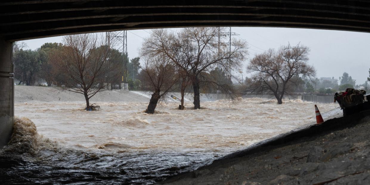 Floodwaters seen rushing through an underpass in Los Angeles, California on Monday (AFP via Getty Images)