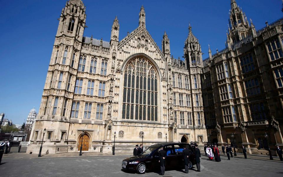 Pc Keith Palmer's coffin is unloaded from a hearse at the Palace of Westminster - Credit: PETER NICHOLLS/Reuters