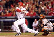 Scott Rolen #27 of the Cincinnati Reds hits an infield single in the sixth inning against the San Francisco Giants in Game Three of the National League Division Series at the Great American Ball Park on October 9, 2012 in Cincinnati, Ohio. (Photo by Andy Lyons/Getty Images)