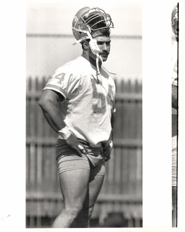 Linebacker Chris Spielman of the Detroit Lions jogs off the field