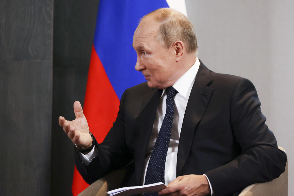 Russian President Vladimir Putin gestures while speaking to Iranian President Ebrahim Raisi on the sidelines of the Shanghai Cooperation Organisation (SCO) summit in Samarkand, Uzbekistan, Thursday, Sept. 15, 2022. (Alexandr Demyanchuk, Sputnik, Kremlin Pool Photo via AP)