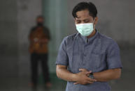 A man wearing mask to help curb the spread of coronavirus outbreak prays at a mosque in Tangerang, Indonesia, Tuesday, Jan. 26, 2021. Indonesia has reported more cases of the virus than any other countries in Southeast Asia. (AP Photo/Tatan Syuflana)