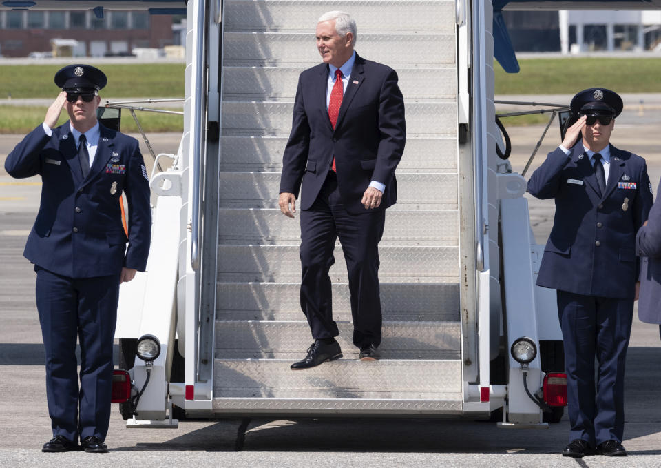 Vice President Mike Pence deplanes Air Force Two after landing at Dobbins Air Reserve Base in Marietta, Ga., Friday, May 22, 2020. (Ben Gray/Atlanta Journal-Constitution via AP)