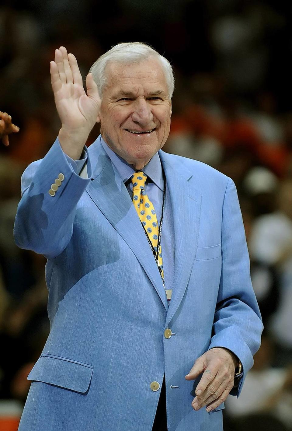 3/15/08 Former UNC Tar Heels head coach Dean Smith acknowledges the cheers of the fans at center court during half time activities in the 2008 ACC Tournament semifinals at Charlotte Bobcats Arena in Charlotte, NC. Smith’s former team the Tar Heels defeated the Hokies 68-66. JEFF SINER -- jsiner@charlotteobserver.com