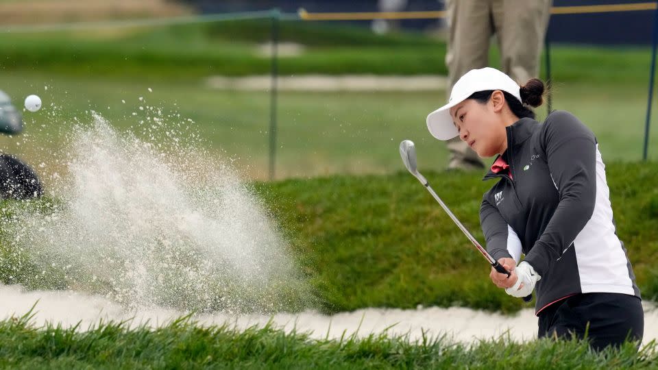 Lin escapes a bunker during the first round. - Godofredo A. Vásquez/AP