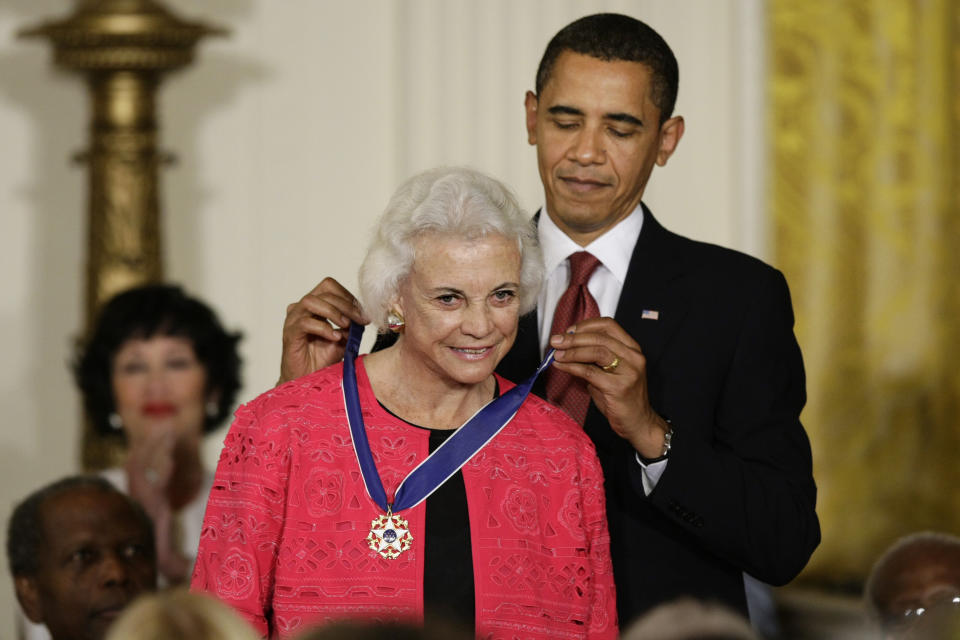 FILE - In this Aug. 12, 2009 file photo, President Barack Obama presents the 2009 Presidential Medal of Freedom to Sandra Day O'Connor. O'Connor, the first woman on the Supreme Court, announced Tuesday that she has the beginning stages of dementia, “probably Alzheimer’s disease.” (AP Photo/J. Scott Applewhite)