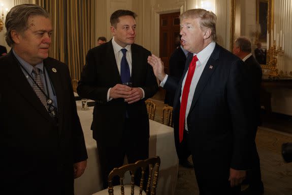 President Donald Trump,  Elon Musk (center) and White House chief strategist Steve Bannon on Feb. 3, 2017.