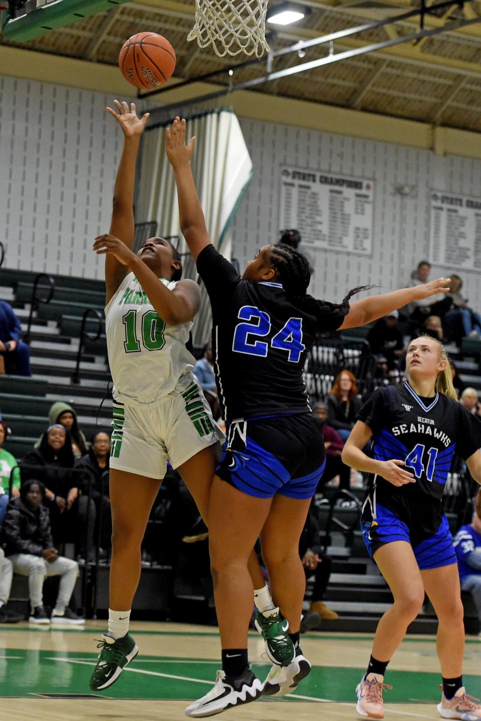 Parkside's Zion Oge (10) shoots by Decatur's Makenzee Purnell (24) Friday, Jan. 12, 2024, in Salisbury, Maryland. Parkside defeated Decatur 62-32.